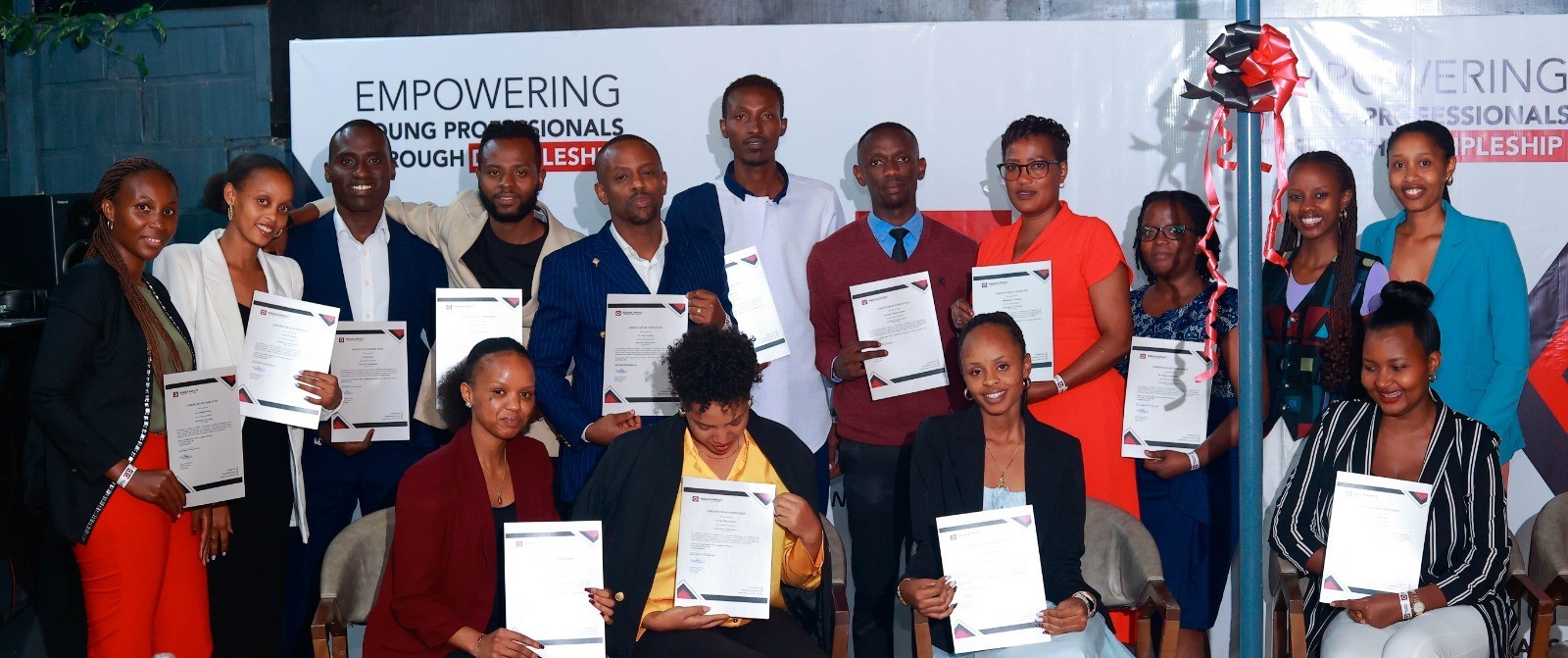 Aquila Impact Cohort 1 graduates holding certificates at the empowerment ceremony